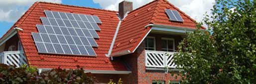 Photo of a house with solar panels on the roof